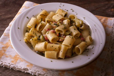 High angle view of pasta in plate on table