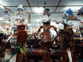 Low angle view of statues for sale in store