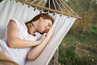 Woman lying down on bed