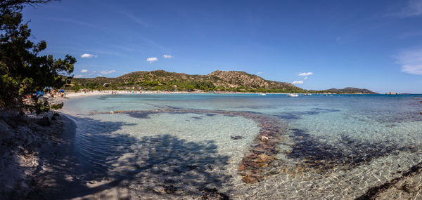 Scenic view of sea against blue sky