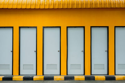 Full frame shot of yellow toilet door
