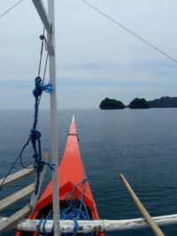 Sailboat on sea against sky