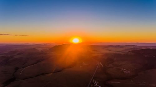 Scenic view of landscape against sky during sunset