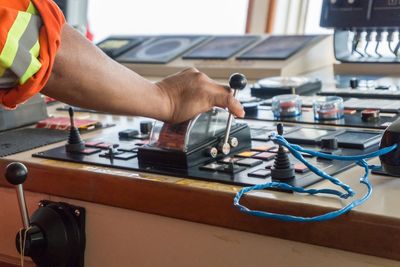 Cropped hand of manual worker in ship