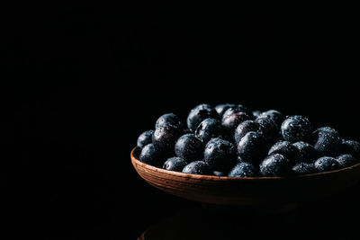 Close-up of fruits against black background