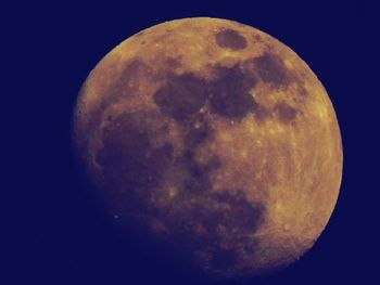 Low angle view of moon against clear sky at night