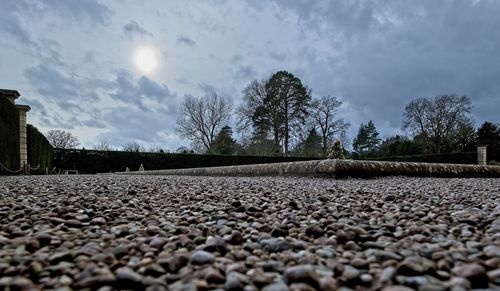 Surface level of stones against sky