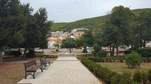 Empty benches in front of house