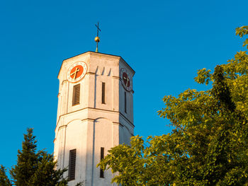 Low angle view of clock tower against sky