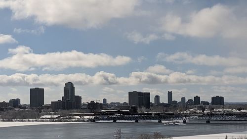 Modern buildings in city against sky