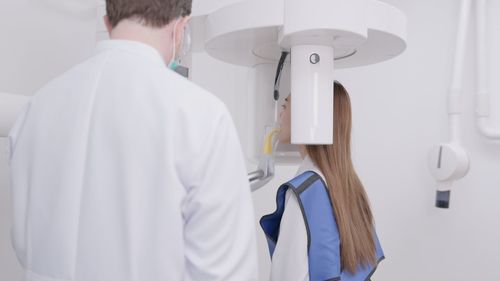 Female doctor examining patient in hospital