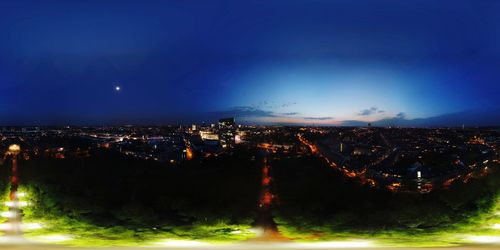 High angle view of illuminated buildings in city at night