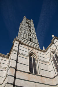 Low angle view of building against blue sky