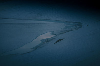 People swimming in sea during winter