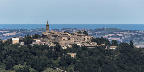 Panoramic view of buildings in city against clear sky