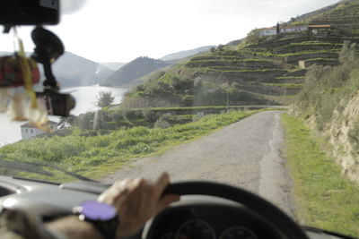 Road seen through car windshield