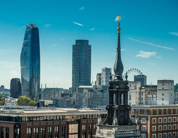 Modern buildings in city against sky