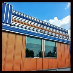 Low angle view of built structure against blue sky