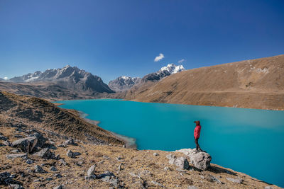 Scenic view of mountains against blue sky