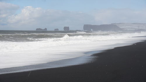 Scenic view of beach against sky