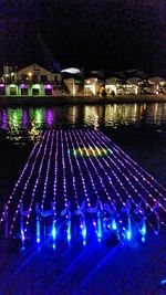 Illuminated fountain at night