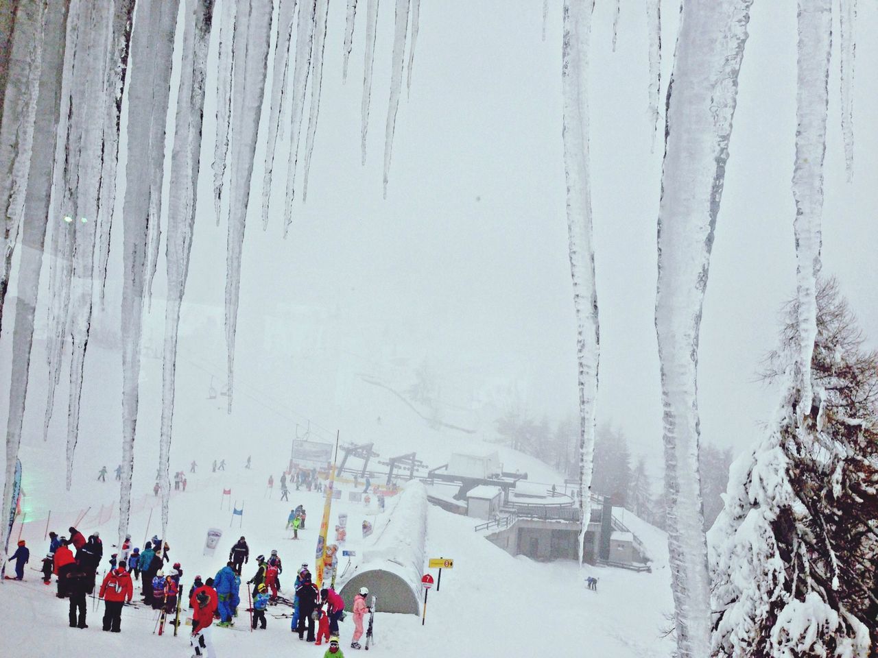 winter, cold temperature, snow, season, water, hanging, weather, nature, day, frozen, tranquility, outdoors, in a row, wood - material, panoramic, incidental people, lake, beauty in nature, tranquil scene, tree