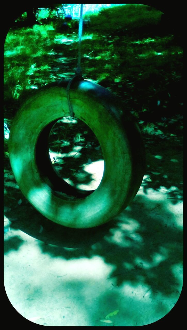 transfer print, circle, water, close-up, metal, auto post production filter, green color, metallic, high angle view, reflection, day, no people, nature, sunlight, outdoors, tree, growth, park - man made space, geometric shape, shape