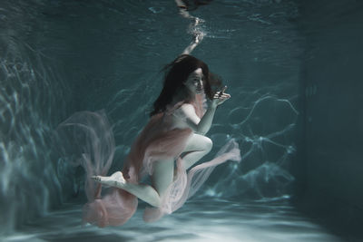 Woman swimming in pool