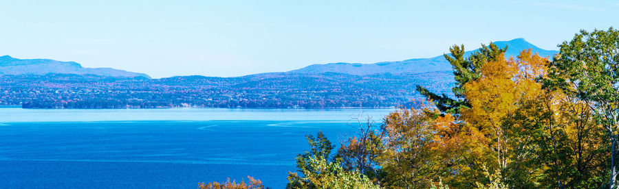 Scenic view of mountains against clear blue sky