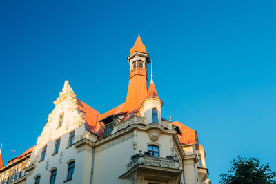 Low angle view of building against blue sky