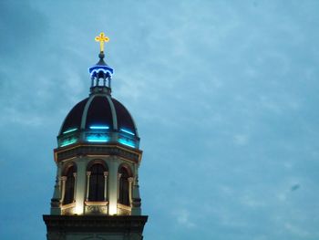 Low angle view of illuminated building against sky