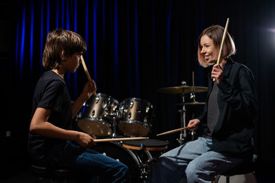 Man and woman sitting at music concert