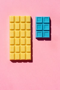 Close-up of multi colored pencils over white background