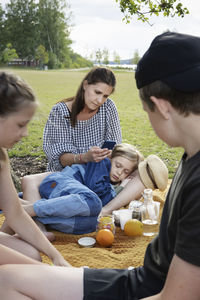 Mother with children having picnic