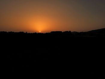 Scenic view of silhouette landscape against sky during sunset