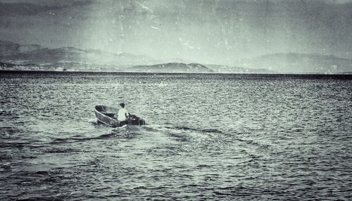 View of swimming in sea against sky