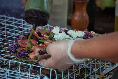 Close-up of hand preparing food