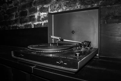 Close-up of electric lamp against wall