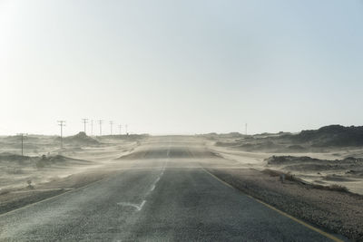 Empty road against clear sky