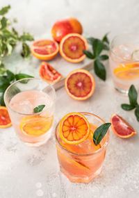 Hard seltzer cocktail with blood orange. cocktail or lemonade with citrus. low alcohol mocktails. 
