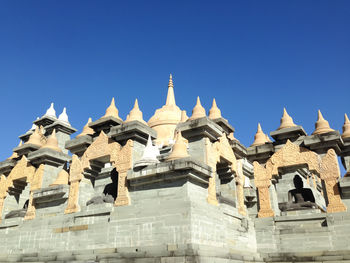 Low angle view of cathedral against blue sky