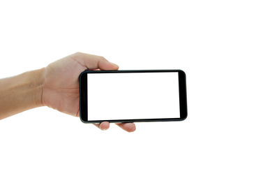 Low angle view of person using smart phone against white background