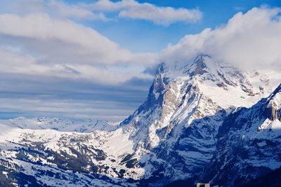Scenic view of snowcapped mountains against sky