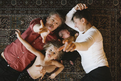 Parents with two children looking at camera