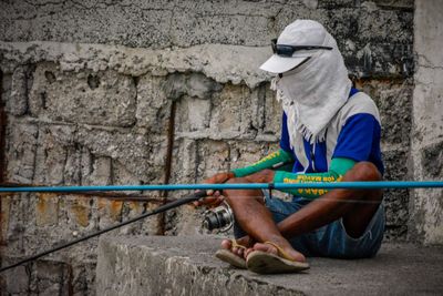 Man sitting on wall