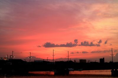 Scenic view of city against sky during sunset