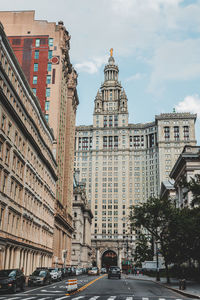 Traffic on road against buildings