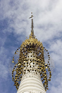 Low angle view of bell tower against sky