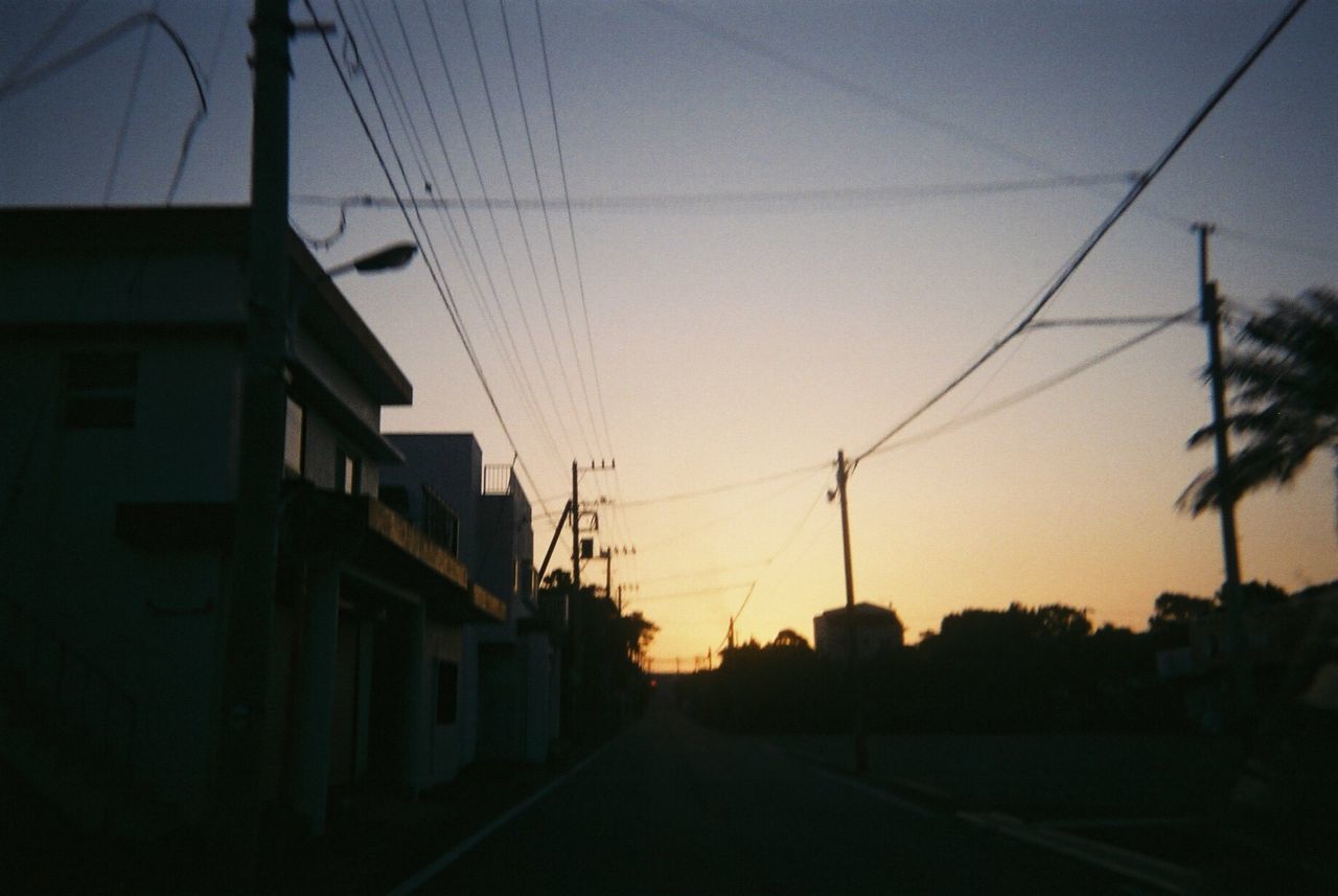 cable, sunset, power line, silhouette, sky, electricity pylon, no people, built structure, power supply, architecture, connection, electricity, road, building exterior, transportation, outdoors, nature, telephone line, technology, tree, clear sky, city, day