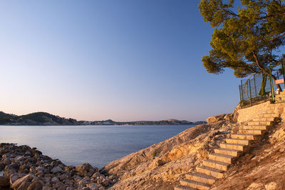 Scenic view of sea against clear blue sky